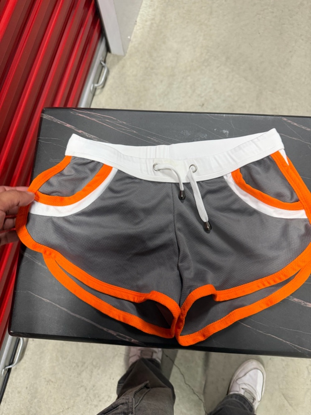 Gray Athletic Shorts with Orange Trim and White Waistband